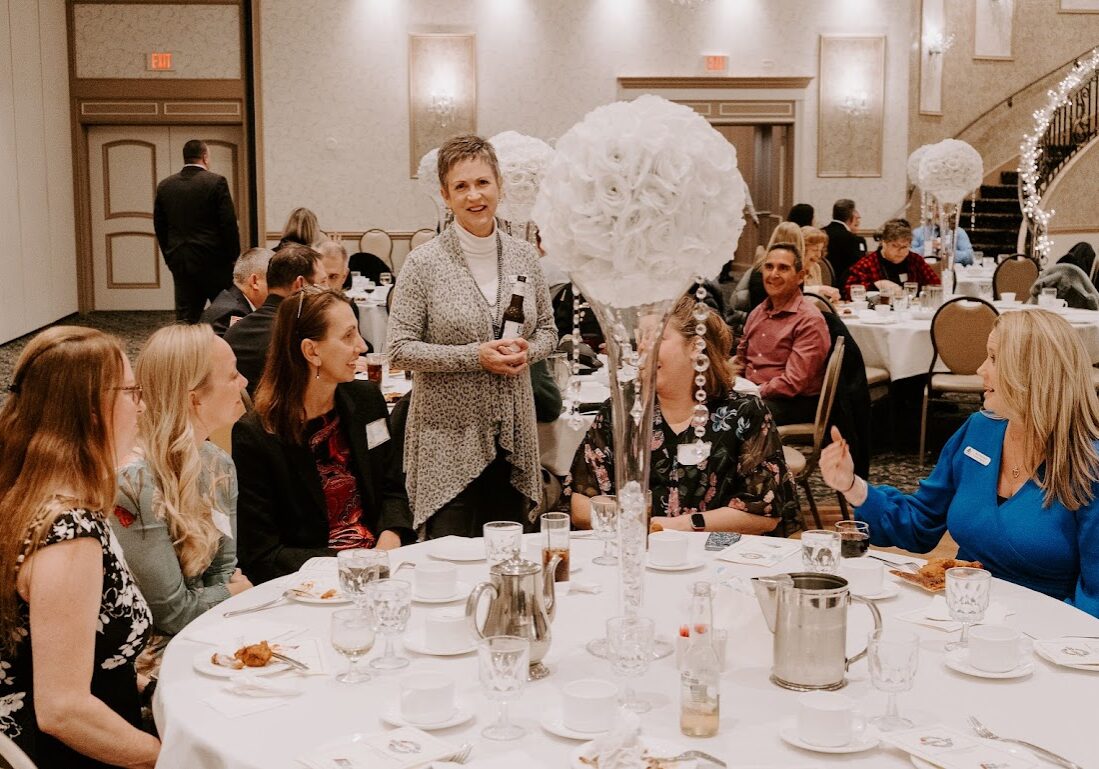 Group conversing at table at Best of Lemont 2022