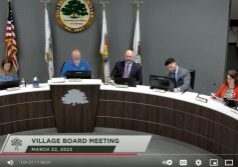 Mayor and trustees sitting at Village of Homer GLen board meeting