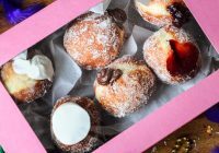 6-pack box of paczki's from wooden paddle